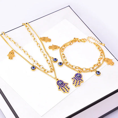 Luxury 18K Gold Blue Zircon Eye Jewelry Set – Double Chain Necklace, Bracelet & Earrings for Women Sylviane